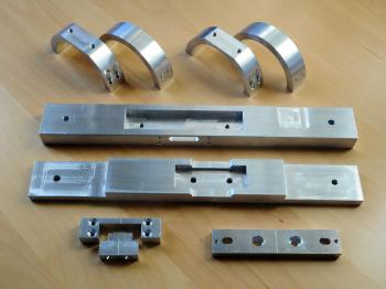 The freshly machined parts for the GTT60 mounting, ready for anodising.