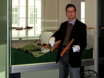 Curator Klaus Staubermann showing the just received cross-staff replica.